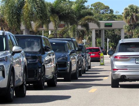 SRQ Airport needs to provide drivers with free shaded parking.
